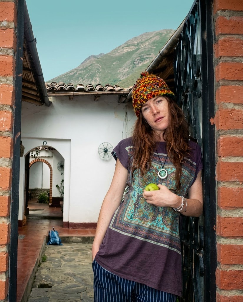 Vero Grados standing in a doorway in the Andes.